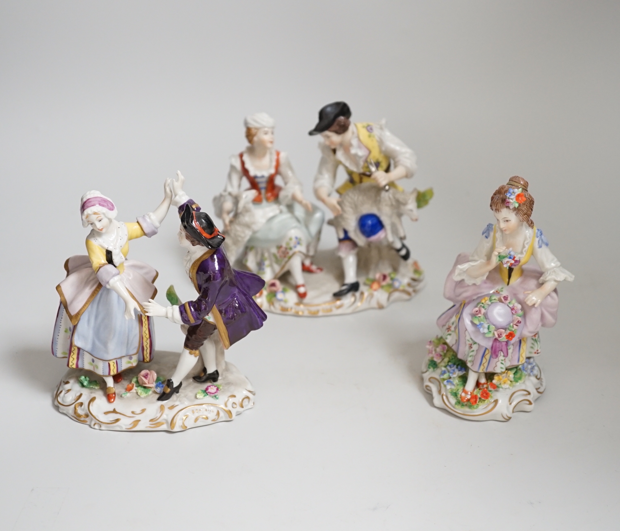A quantity of porcelain figures and groups including eight Sitzendorf examples and Royal Doulton Marie, HN1635, the largest 19cm high